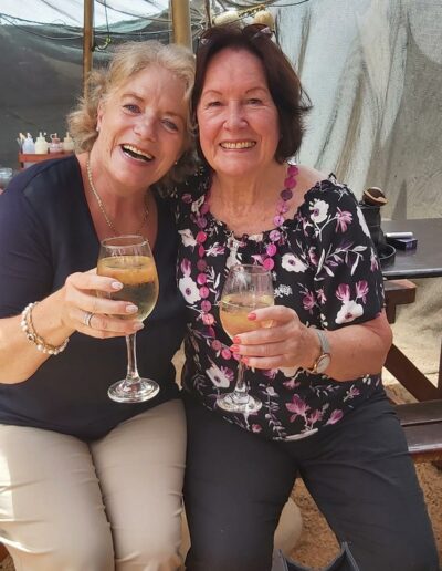 two women drinking wine
